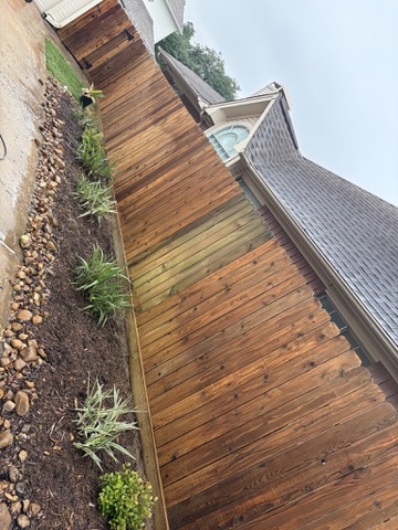 Wood fence cleaning project in progress in Katy, TX